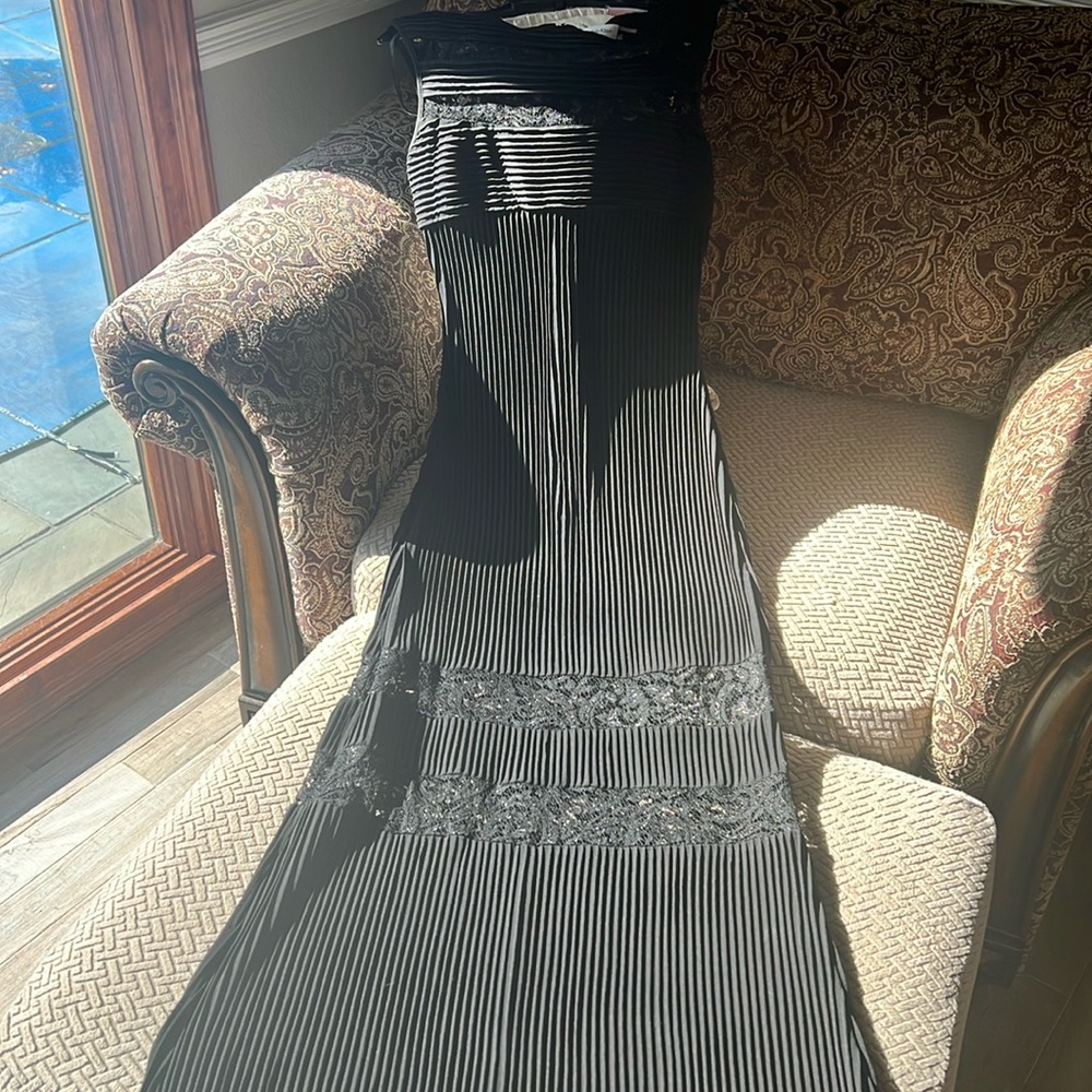Worn once size 4 Calvin Klein long dress with sheer lace on top and bottom. Sexy